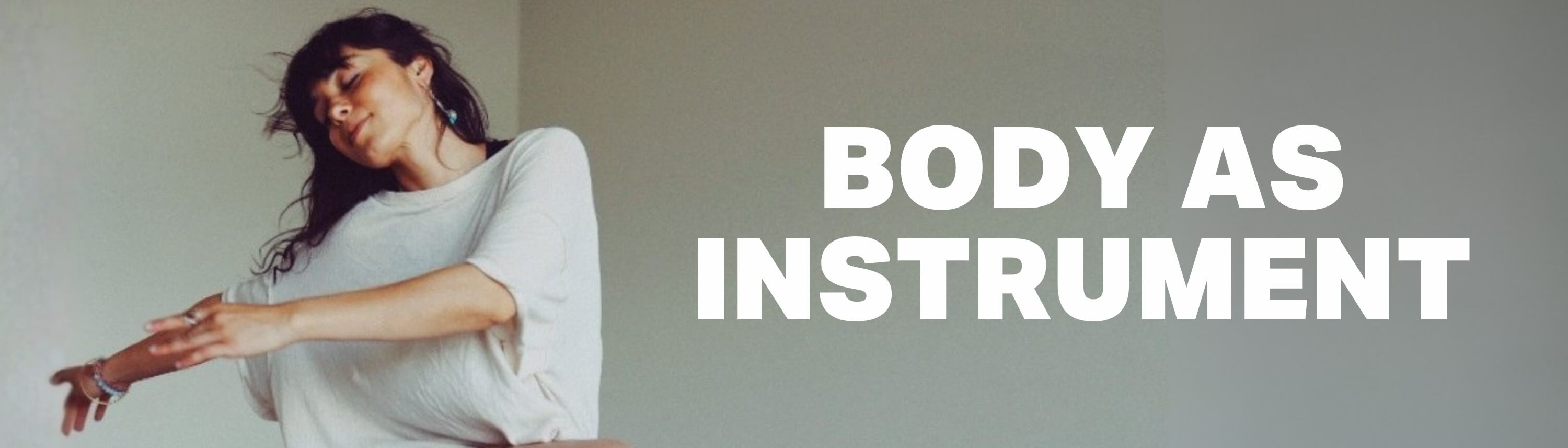 A person in a loose white shirt dances expressively against a plain background with the words BODY AS INSTRUMENT in bold white text beside them.